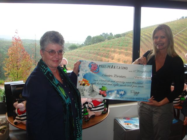  Progressive winner, Hester Nortier, receives her cheque from Wendy Graaf, Group Marketing Manager of  Piggs Peak Casino